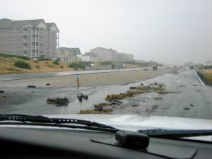Debris washed over Ocean Shores Boulevard next to the Jetty.